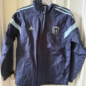 Adidas Spirting KC Kids Dark Blue Rain jacket with Light Blue Accents
